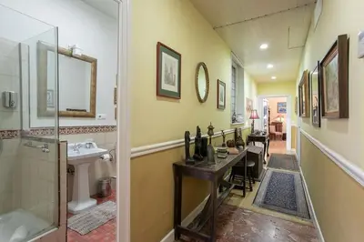 a bathroom with a shower and a sink and a table at Canela Homes BARCELONA CLASSIC in Barcelona