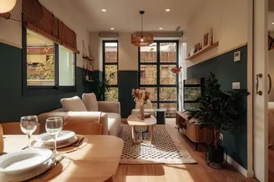 a living room with a couch and a table at Casa Morera in Barcelona