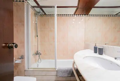 a bathroom with a tub and a sink and a shower at Canela Homes BARCELONA MONUMENTAL in Barcelona