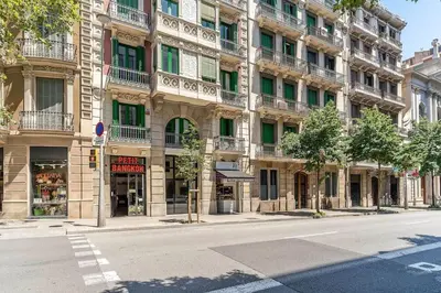 an empty street in front of a large building at Canela Homes BARCELONA PATIO in Barcelona
