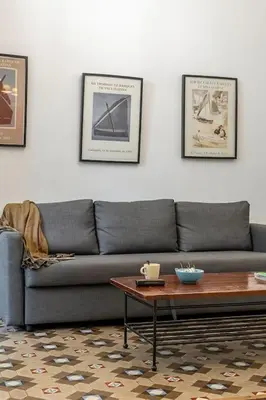 a living room with a couch and a coffee table at Canela Homes BARCELONA PATIO in Barcelona
