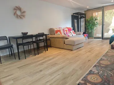 a living room with a couch and a table at INSPIRA MAISON Montaña y Mar in Teià
