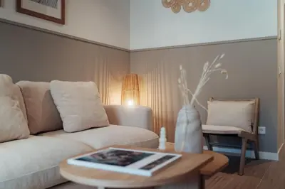 a living room with a couch and a table at Casa Tamarita in Barcelona