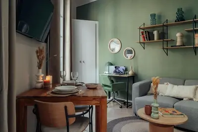 a living room with a table and a couch at Casa Tapiz in Barcelona