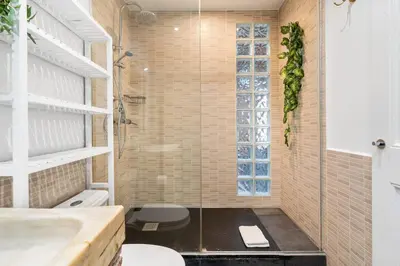a bathroom with a sink and a toilet and a shower at Sunny Retro Flat Balcony in Poble Sec in Barcelona