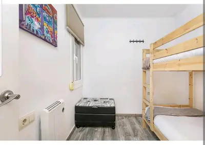 a room with two bunk beds and a window at Apartamento BB in Hospitalet de Llobregat