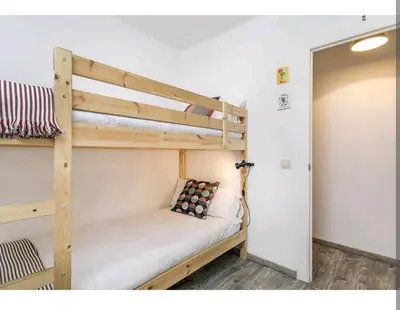 a bedroom with two bunk beds in a room at Apartamento BB in Hospitalet de Llobregat