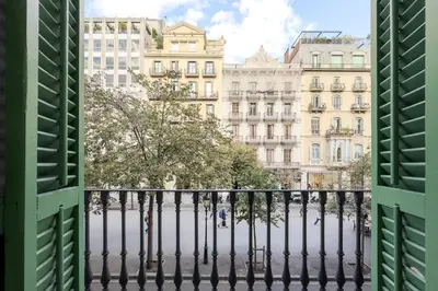 a view from a window of a street with buildings at Apartamento Rambla Cataluña 35 in Barcelona