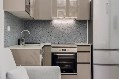 a kitchen with a stove and a sink at Apartamento Rambla Cataluña 35 in Barcelona