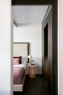 a bedroom with a bed and a table with a lamp at The Passage Homes - Simaba Group in Barcelona
