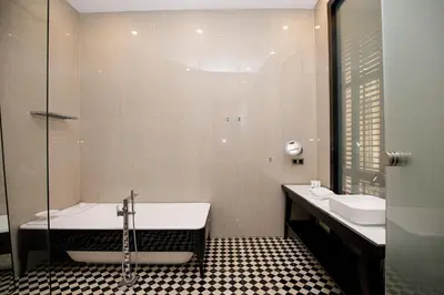 a bathroom with a tub and a sink at beautiful cosy modern apartment ,19th century building in Barcelona