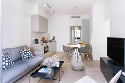 a living room with a couch and a table at Casa Mercader - Simaba Group in Barcelona