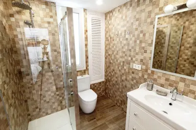a bathroom with a toilet and a sink and a shower at Sitges Centre Mediterranean House- 5 Bedroom, 4 Bathroom, Terrace Courtyard, Private Rooptop Pool in Sitges