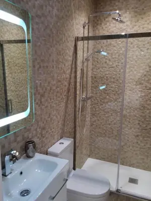 a bathroom with a shower and a toilet and a sink at Sitges Centre Mediterranean House- 5 Bedroom, 4 Bathroom, Terrace Courtyard, Private Rooptop Pool in Sitges
