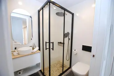 a bathroom with a shower with a toilet and a sink at Masnou Chill in Masnou