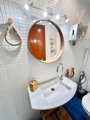 a bathroom with a sink and a mirror at Barcelona Raval in Barcelona