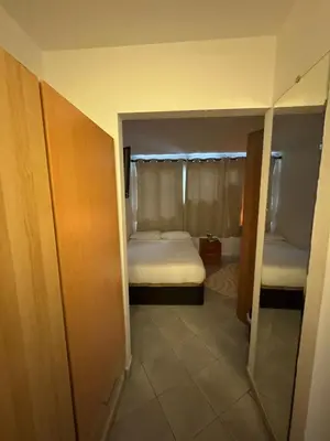 a small room with a bed and a closet at Tranquilo y céntrico in Barcelona
