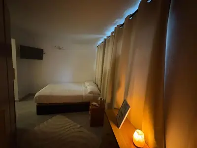 a hotel room with two beds and a television at Tranquilo y céntrico in Barcelona