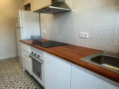 a kitchen with a sink and a counter top at Ático gran terraza cerca BCN in Castelldefels
