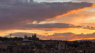a view of a city at sunset at Top Studio with Terrace in Barcelona