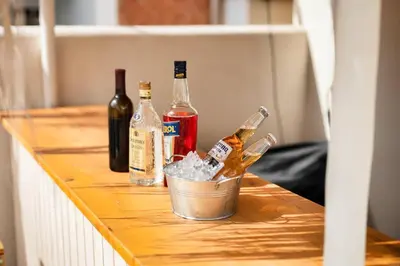 a group of bottles of alcohol on a table at El Niu Apartamentos con terraza Camp Nou in Hospitalet de Llobregat