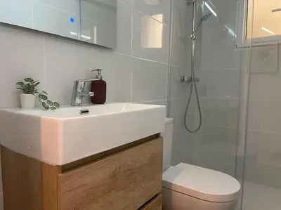 a bathroom with a sink and a shower and a toilet at Jordi home 15 minutes to center by train in Sant Adria de Besos
