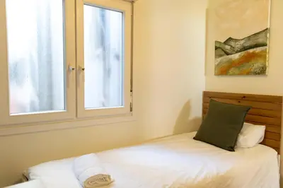 a bedroom with a bed and a window at 