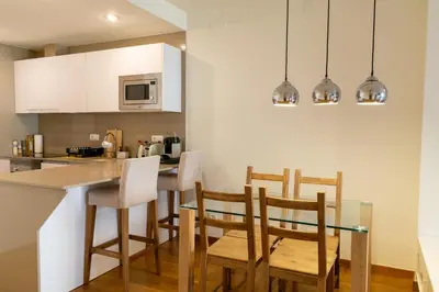 a kitchen and dining room with a table and chairs at 