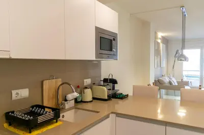 a kitchen with white cabinets and a counter top at 