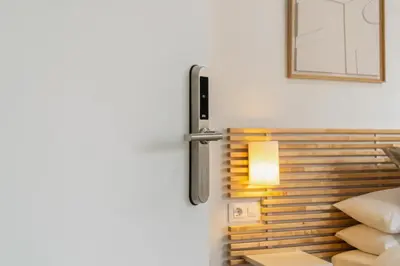 a advertisement for a self check in light in a room at Livinn House - Self Check in in Hospitalet de Llobregat