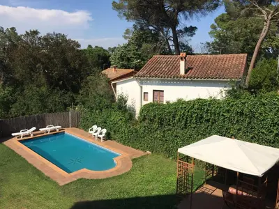 a swimming pool in the yard of a house at Eco house of oak, 15 min to BCN Max Pax 8 in Sant Cugat del Vallès