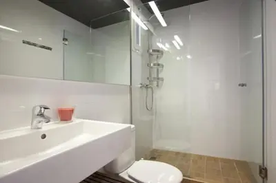 a bathroom with a sink and a toilet and a shower at Barceloneta near Beach Apartments in Barcelona