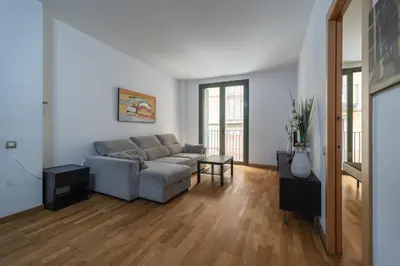 a living room with a couch and a table at Near Ramblas apartment 3 room flat Min 32 days in Barcelona