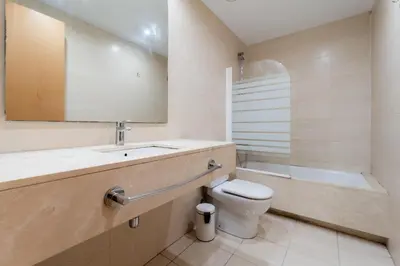a bathroom with a toilet and a sink and a mirror at Near Ramblas apartment 3 room flat Min 32 days in Barcelona