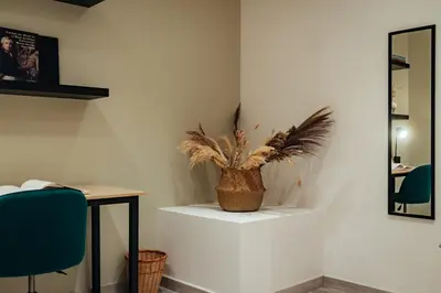 a room with a table and a potted plant at Casa Central in Barcelona