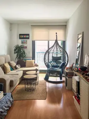 a living room with a couch and a swing at Lovely Room near Park Guell in Barcelona