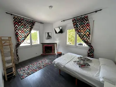 a bedroom with a bed and a fireplace at Casa Vallromanes Rest House in Vallromanas