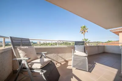 a balcony with chairs and a view of the ocean at Villa Sitges Cambera 10 minutos de Playa andando Muy Comoda Area Tranquila in Sitges