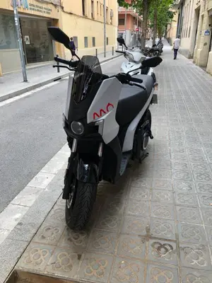 a motorcycle parked on the side of a street at Charming modern flat in Barcelona in Barcelona