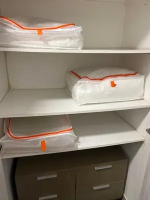a white refrigerator with two shelves with orange labels at Cozy apartment close to the beach for 2 persons in Gavà