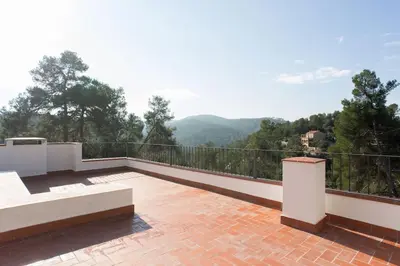a balcony with a view of the mountains at Tranquilidad cerca de Barcelona in Molins de Rei