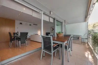 a dining room with a table and chairs at CCIB Forum Deluxe Apartment in Sant Adria de Besos