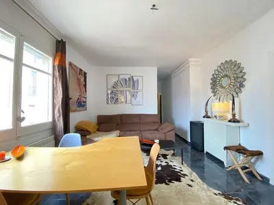a bed with a blue comforter with sheep on it at Double room with inside window in shared apartment in Barcelona