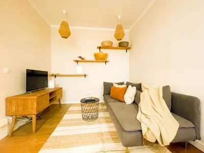 a living room with a couch and a television at Boutique Casanova in Barcelona