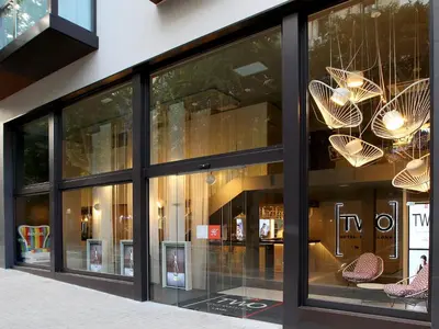 a store front with windows with chairs and chandeliers at Axel TWO Barcelona 4 Sup - Adults Only in Barcelona