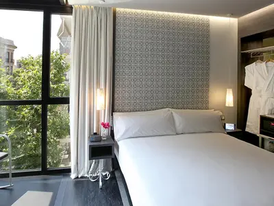 a bedroom with a white bed and a large window at Axel TWO Barcelona 4 Sup - Adults Only in Barcelona