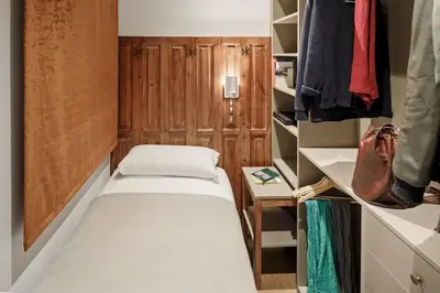 a small room with a bed and a closet at Pau Claris Double - Home next to Paseo de Gracia in Barcelona