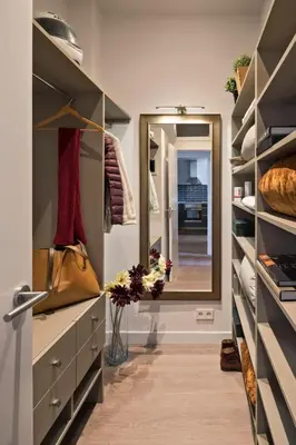 a walk in closet with a mirror and a purse at Pau Claris - Design apt next to Paseo de Gracia in Barcelona