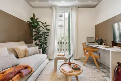 a bedroom with a bed with a mirror on the wall at Veduto - 2 bedrooms in Eixample Esquerra in Barcelona