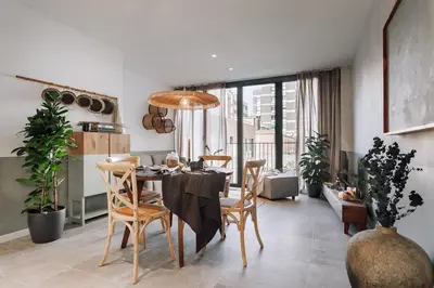 a kitchen and dining room with a table and chairs at Mojacar - 2 bedrooms in Eixample Esquerra in Barcelona